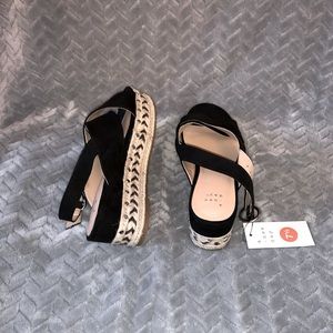 Black suede wedge sandals with metal detail